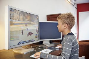 Young Boy Playing World Of Warcraft