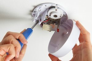 Homeowner Installing a DIY Home Security System