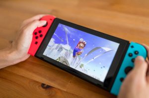 Hands Holding Nintendo Switch Console