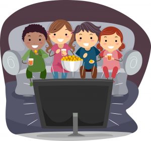 Family On Couch Watching Movie